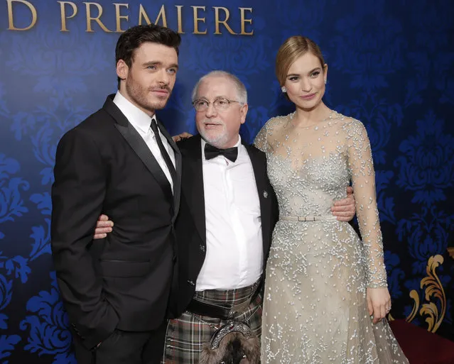Richard Madden, composer Patrick Doyle and Lily James attend the World Premiere Of "Cinderella" on Sunday, March 1, 2015, in Los Angeles. (Photo by Todd Williamson/Invision/AP)