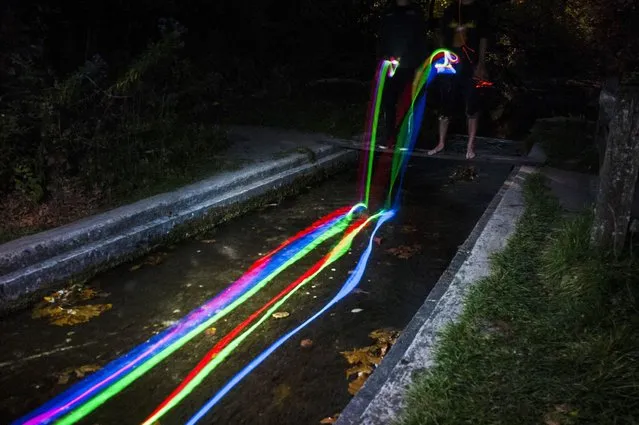 “Neon Luminance” glowstick waterfall photography, California, America. (Photo by Sean Lenz/Kristoffer Abildgaard)