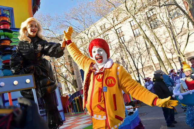 Singer Rita Ora high fives with Ronald McDonald during the the 2018 Macy's Thanksgiving Day Parade on November 22, 2018 in New York City. (Photo by Michael Loccisano/Getty Images)