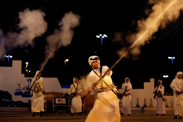 Saudi men fire weapons as they perform a traditional dance during Janadriyah Cultural Festival on the outskirts of Riyadh, Saudi Arabia on January 1, 2019. (Photo by Faisal Al Nasser/Reuters)