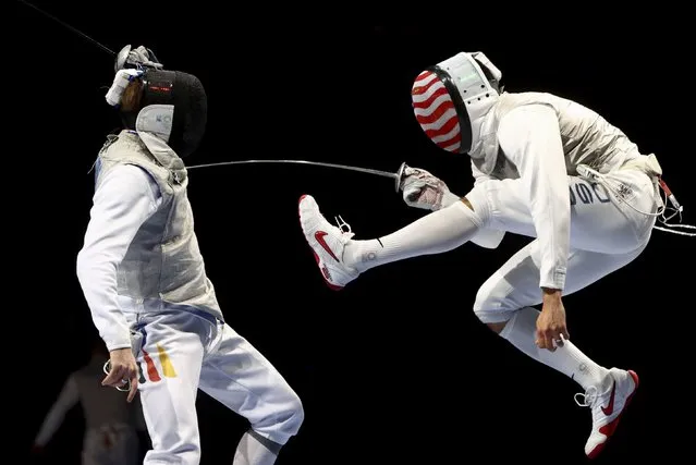 Benjamin Kleibrink, left, of Germany, in action against Gerek Meinhardt, of the United States, during men's fencing team foil quarterfinal at Makuhari Messe Hall B in Chiba, Japan on August 1, 2021. (Photo by Maxim Shemetov/Reuters)