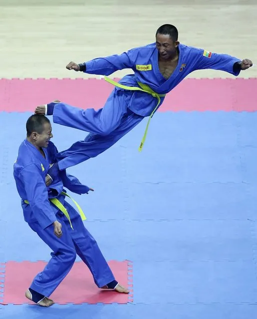 Team Myanmar competes in the Vovinam, Don Chan Tan Cong category during the 2013 Southeast Asian Games at Zayar Thiri Indoor Stadium A on December 19, 2013 in Nay Pyi Taw, Myanmar. (Photo by Suhaimi Abdullah/Getty Images)
