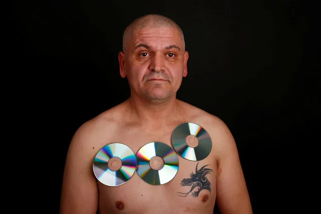 Nermin Halilagic, 38, poses with CDs in Bihac, Bosnia and Herzegovina, January 23, 2017. (Photo by Dado Ruvic/Reuters)