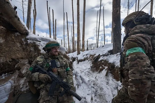 Ukrainian soldiers of Ukrainian National Guard hold their positions in the snow-covered Serebryan Forest in temperatures of –15°C on January 12, 2024 in Kreminna, Donetsk Oblast, Ukraine. (Photo by Kostiantyn Liberov/Libkos/Getty Images)