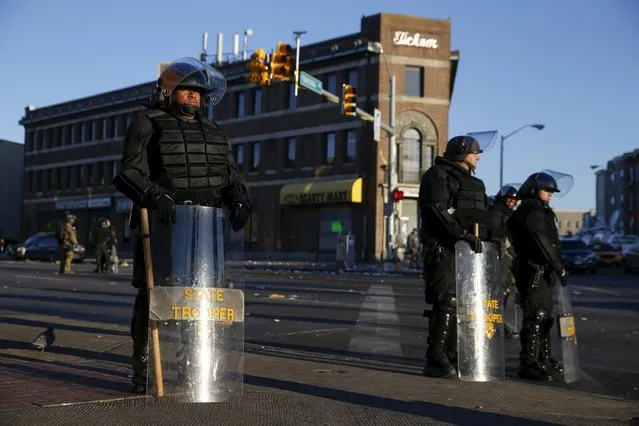 Baltimore state troopers stand guard on Pennsylvania avenue in Baltimore, Maryland April 28, 2015. (Photo by Shannon Stapleton/Reuters)