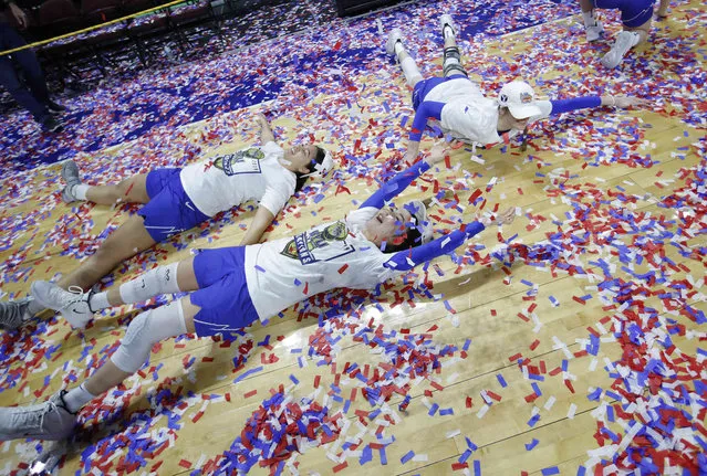 BYU's Shaylee Gonzales, front, and others celebrate after defeating Gonzaga in an an NCAA college basketball game for the West Coast Conference women's tournament title Tuesday, March 12, 2019, in Las Vegas. (Photo by John Locher/AP Photo)