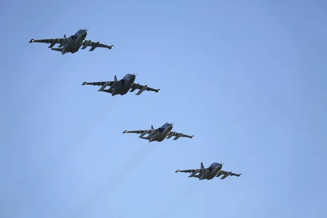 Russian Sukhoi Su-25 fighter jets fly in formation after returning from Syria, before landing at an airbase in Krasnodar region, southern Russia, in this March 16, 2016 handout photo by the Russian Ministry of Defence. (Photo by Olga Balashova/Reuters/Russian Ministry of Defence)