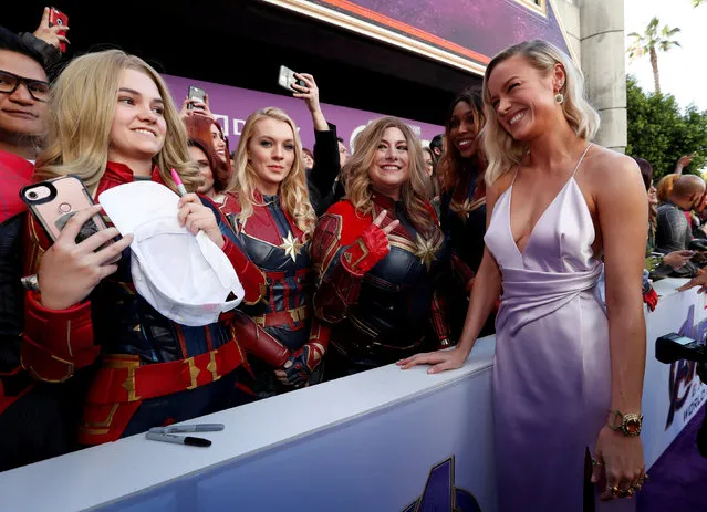 Cast member Brie Larson poses with fans on the red carpet at the world premiere of the film "The Avengers: Endgame" in Los Angeles, California, April 22, 2019. (Photo by Mario Anzuoni/Reuters)