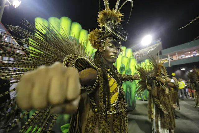 A performer from the Imperio da Tijuca samba school parades during carnival celebrations at the Sambadrome in Rio de Janeiro, Brazil, Sunday, March 2, 2014. (Photo by Nelson Antoine/AP Photo)