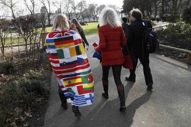 A demonstrator wears a flag of EU countries during a pro-Europe protest outside the Houses of Parliament in London, Britain, February 20, 2017. (Photo by Stefan Wermuth/Reuters)