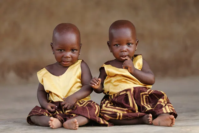 Identical twins Taiwo Adejare and Kehinde Adejare pose for a picture in Igbo Ora, Oyo State, Nigeria on April 4, 2019. (Photo by Afolabi Sotunde/Reuters)