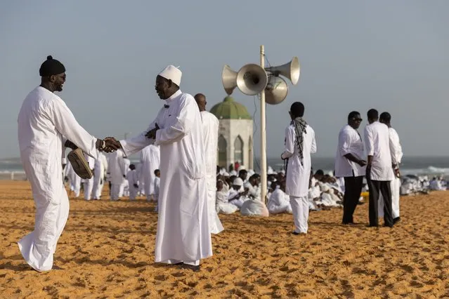 Muslim faithfuls greet each other before Eid al-Fitr prayer in Yoff, Senegal, 10 April 2024. Muslims worldwide celebrate Eid al-Fitr, a two or three-day festival at the end of the Muslim holy fasting month of Ramadan. It is one of the two major holidays in Islam. During Eid al-Fitr, Most People travel to visit each other in town or outside of it and children receive new clothes and money to spend on the occasion. (Photo by Jérôme Favre/EPA/EFE)