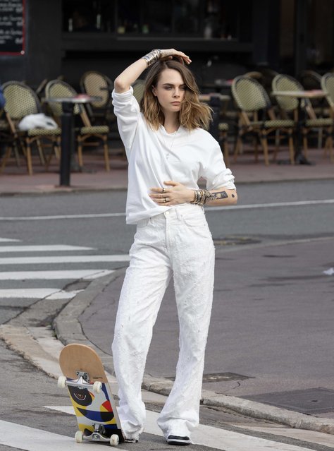 English model and actress Cara Delevingne on April 10, 2024 shoots an advertisement on the Croisette in Cannes in front of the Martinez hotel alongside French model Baptiste Giabiconi. Cara has kept busy with work, modeling and performing on the West End despite suffering from a devastating fire that gutted her L.A. mansion. (Photo by The Image Direct)