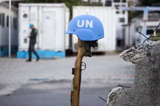This February 22, 2017 photo shows a U.N. peacekeeper's blue helmet balanced on a weapon in Port-au-Prince, Haiti. “We have a secure and stable environment”, said Col. Luis Antonio Ferreira Marques Ramos, deputy commander of the Brazilian peacekeeper contingent in Haiti. “The important thing is to leave in a good way”. (Photo by Dieu Nalio Chery/AP Photo)