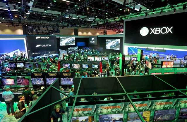 E3 2015 attendees interact with newly announced games and experiences at the Xbox booth at E3 in Los Angeles on Tuesday, June 16, 2015. (Photo by Casey Rodgers/Invision for Microsoft/AP Images)