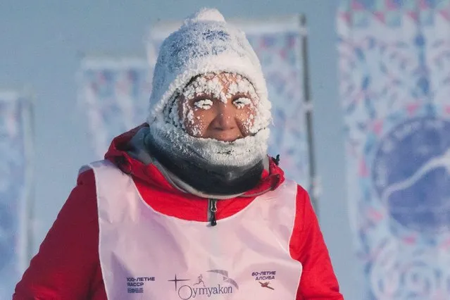 A runner takes part in the International World's coldest marathon at minus 53 degrees (–63.4 Fahrenheit) near Oymyakon, the republic of Sakha, also known as Yakutia, Russian Far East, Saturday, January 22, 2022. Sixty five runners, including athletes from the United Arab Emirates, United States and Belarus, started the run at extremely low temperature in Oymyakon, Yakutia's Pole of Cold. The international team of men and women ran full distance and half-marathon. (Photo by Ivan Nikiforov/AP Photo)