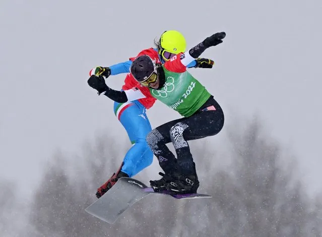 Lindsey Jacobellis of the United States (front) and Michela Moioli of Italy in action during the Mixed Team Snowboard Cross Big Final during the Winter Olympic Games on February 12th, 2022 in Zhangjiakou, China. (Photo by Dylan Martinez/Reuters)