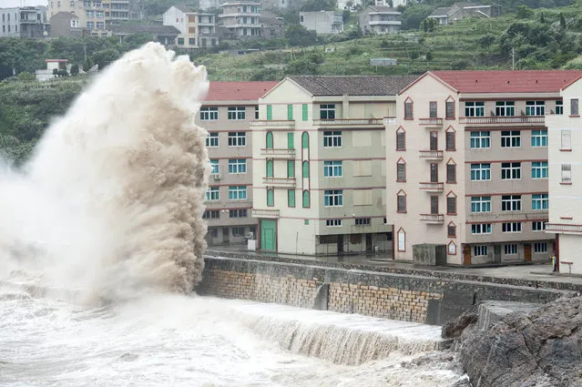 Huge waves are seen as typhoon Chan-hom comes near Wenling, east China's Zhejiang province on July 10, 2015. Typhoon Chan-hom lashed Japan's Okinawa island chain on July 10 as it pushed towards Taiwan and onto China, leaving more than 20 people injured. (Photo by AFP Photo)