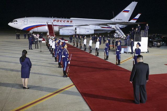 North Korea's leader Kim Jong Un, back to a camera, stands waiting to meet Russian President Vladimir Putin at the Pyongyang Sunan International Airport outside Pyongyang, North Korea, early Wednesday, June 19, 2024. (Photo by Vladimir Smirnov, Sputnik, Kremlin Pool Photo via AP Photo)