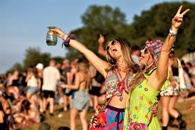 People gather at the Glastonbury Festival site in Somerset, Britain on June 21, 2023. (Photo by Jason Cairnduff/Reuters)