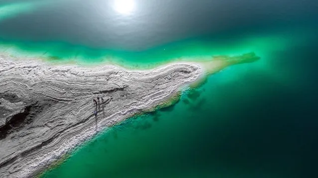 An aerial view of the Dead Sea, located 50 km from the capital Amman in Jordan on April 12, 2022. The Dead Sea, famous for its mud used for skin treatment, is one of the most visited places in Jordan by tourists. The lake, which has no life due to its high salt content, is called the “Dead Sea”. Most of the shores are covered with salt formation. The Dead Sea is considered the lowest point in the world. (Photo by Ali Balikci/Anadolu Agency via Getty Images)
