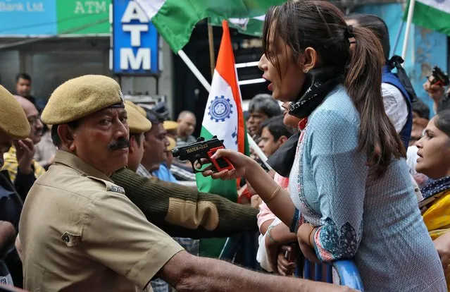 A demonstrator holds a toy gun after police stopped the demonstrators at a barricade during a protest rally against a new citizenship law, in Kolkata, India, February 5, 2020. (Photo by Rupak De Chowdhuri/Reuters)