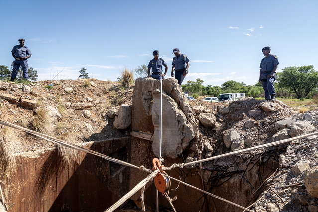 A system of pulleys and ropes installed by members of the South Africa Police Service is set up over an entrance to a disused gold mine shaft in Stilfontein, around 150 kilometres south-west of Johannesburg, South Africa, 17 November 2024. A South African court has ordered the lifting of a police blockade of the abandoned gold mine, in which people are illegally located. Police had blocked the mine in an attempt to force the people inside to exit. (Photo by EPA/Stringer)