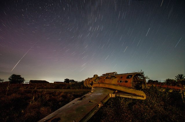 A view from an abandoned military airbase shows the night sky during the annual Perseid meteor shower in the region of Kakheti, Georgia on August 12, 2024. (Photo by Irakli Gedenidze/Reuters)