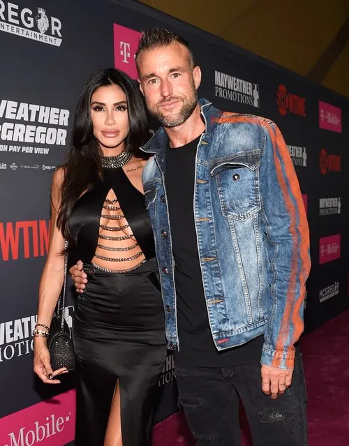 Morgan Osman (L) and fashion designer Philipp Plein arrive on T-Mobile's magenta carpet duirng the Showtime, WME IME and Mayweather Promotions VIP Pre-Fight Party for Mayweather vs. McGregor at T-Mobile Arena on August 26, 2017 in Las Vegas, Nevada. (Photo by David Becker/Getty Images for Showtime)