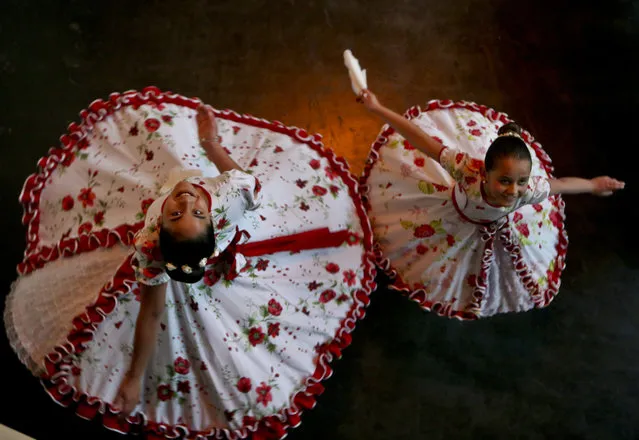 In this August 19, 2017 photo, transgender girls Josefa, 13, left, and Selenna, 8, pose for a picture as they twirl in traditional Chilean dance costumes before an event marking Transgender Children Day in Santiago, Chile. The center-left government has been pushing an array of measures for gender rights, ranging from decriminalizing some abortions to demanding greater acceptance for transgender people in general and children in particular. (Photo by Esteban Felix/AP Photo)