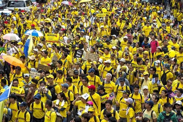 Supporters of pro-democracy group “Bersih” (Clean) gather near Chinatown in Malaysia's capital city of Kuala Lumpur, Malaysia, August 29, 2015. Thousands of protesters gathered in Kuala Lumpur on Saturday for a two-day rally to demand the resignation of Prime Minister Najib Razak, bringing to the streets a political crisis over a multi-million-dollar payment made to an account under his name. (Photo by Athit Perawongmetha/Reuters)