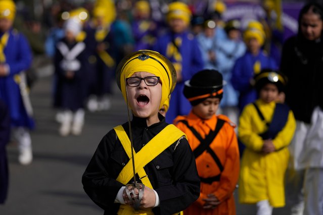 An Indian Sikh boy shouts religious slogans during a procession ahead of the birth anniversary of Guru Gobind Singh in Jammu, India, Friday, January 3, 2025. (Photo by Channi Anand/AP Photo)