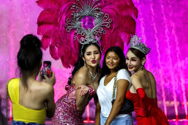 Peerapong Butakul, a transgender person also known as “Bee”, takes pictures with fans after the reopening of Tiffany's show after closing for almost three years due to the coronavirus disease (COVID-19) pandemic, in Pattaya, Thailand on September 1, 2022. (Photo by Athit Perawongmetha/Reuters)