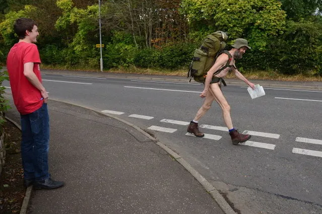 Stephen Gough the naked rambler makes his way south through Peebles in the Scottish Borders, following his release from Saughton Prison yesterday after serving his latest sentence on October 6, 2012 in Peebles, Scotland. The rambler has 18 convictions and has been in prison on and off since 2006 with offences ranging from not wearing clothes in front of the sheriff, breach of the peace and contempt of court.  (Photo by Jeff J. Mitchell)