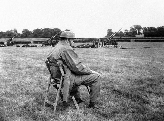 The Prime Minister Winston Churchill toured southern England, on June 30, 1944, and saw measures being taken to deal with the flying bombs. He visited gun sites and saw guns and fighters in action against them.  The Prime Minister at a battery. (Photo by AP Photo)