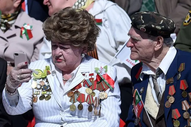 Veterans gather to watch a military parade to mark the 75th anniversary of the Soviet Union's victory over Nazi Germany in World War Two, in Minsk on May 9, 2020. (Photo by Sergei Gapon/AFP Photo)