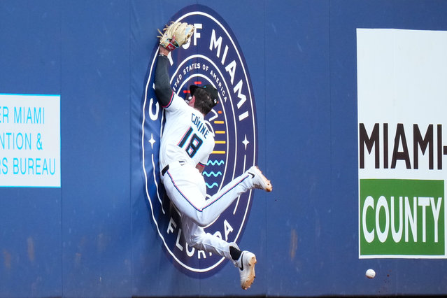 Griffin Conine #18 of the Miami Marlins attempts to catch a fly ball hit by Brandon Nimmo #9 of the New York Mets (not pictured) during the sixth inning at loanDepot park on April 02, 2025 in Miami, Florida. (Photo by Rich Storry/Getty Images)
