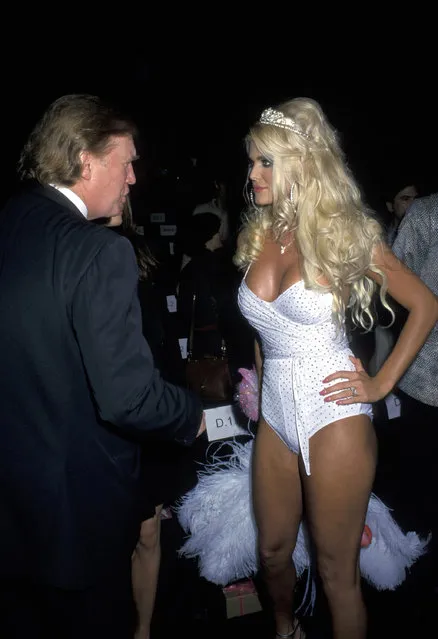 Donald Trump talks with a Playboy Bunny during the Betsey Johnson Spring 2001 Fashion Show at Bryant Park in New York City on September 19, 2000. (Photo by Ron Galella/WireImage/Getty Images)