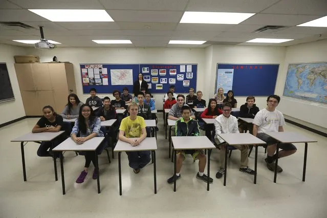 Teacher Kathy Stauch's 9th Grade French-immersion geography class pose for a picture at Lisgar Collegiate Institute in Ottawa, Canada, September 24, 2015. (Photo by Chris Wattie/Reuters)