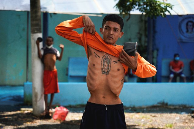 An inmate shows his physical condition in a pavilion at the Penitenciaria del Litoral prison, amid an outbreak of tuberculosis at the facility, in Guayaquil, Ecuador, on April 9, 2025. (Photo by Santiago Arcos/Reuters)