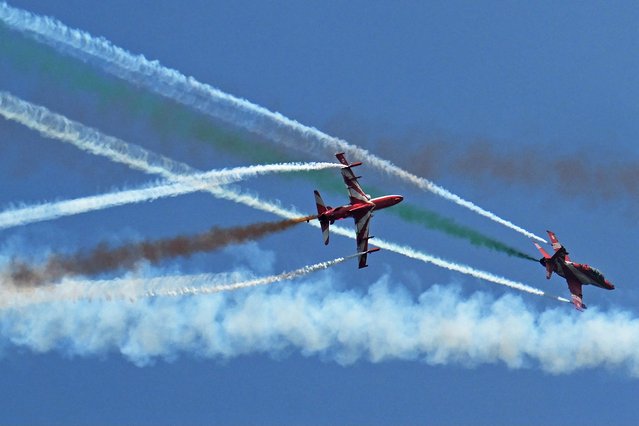 The Indian Air Force (IAF) Surya Kiran aerobatics team performs during the inaugural day of the 15th edition of 'Aero India 2025', a military aviation exhibition at the Yelahanka Air Force Station in Bengaluru on February 10, 2025. (Photo by Idrees Mohammed/AFP Photo)