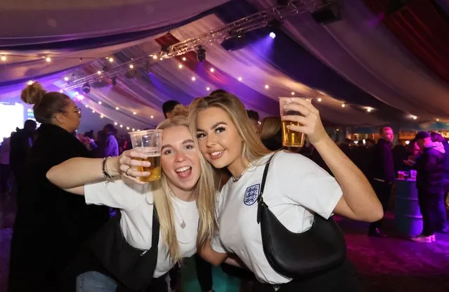 Hannah Douglas and Amelia Weight cheering on the Three Lions in London, United Kingdom on December 4, 2022. Fans gather at BoxPark Wembley to watch England play Senegal in the 2022 World Cup finals. (Photo by NNP Photography)