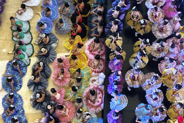 Indonesian ballet students gather during competition at shopping mall in Bekasi, on the outskirt of Jakarta, Sunday, April, 27, 2025. (Photo by Achmad Ibrahim/AP Photo)
