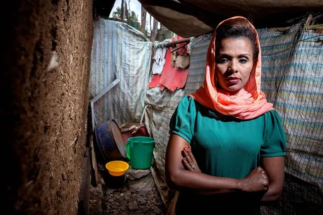 Ethiopia. Meseret, a restaurant manager in Addis Ababa, shares a one bedroom government house with her two children, two sisters and mother. She was widowed nine years ago when her husband was shot during the aftermath of the 2005 elections. Her shared toilet is a long way away so at night, for safety, the family use the side yard next to their house. (Photo by Petterik Wiggers/WSUP/Panos)