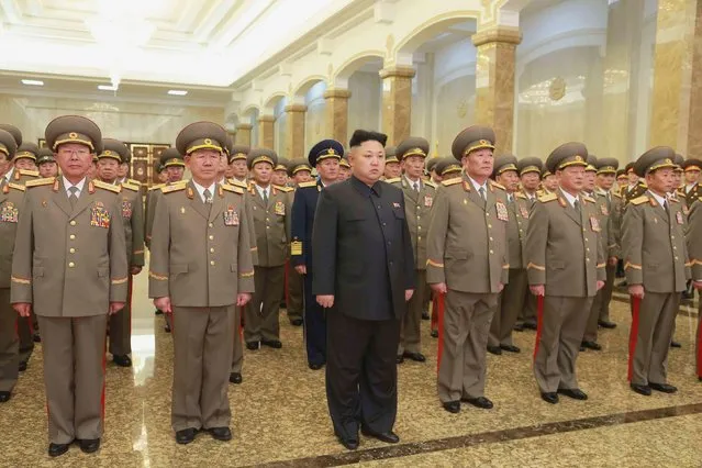 North Korean leader Kim Jong Un (C) pays his respects to North Korean founder Kim Il Sung and his father Kim Jong Il at Kumsusan Palace of the Sun, in this January 1, 2015 photo released by North Korea's Korean Central News Agency (KCNA) in Pyongyang. (Photo by Reuters/KCNA)