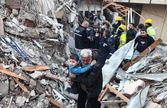 Eight-year-old Yigit Cakmak (L, front) is pulled to safety from the rubble of a collapsed building, some 52 hours after a major earthquake, in Hatay, Turkey, 08 February 2023. More than 7,000 people have died and thousands more injured after two major earthquakes struck southern Turkey and northern Syria on 06 February. Authorities fear the death toll will keep climbing as rescuers look for survivors across the region. (Photo by Erdem Sahin/EPA/EFE/Rex Features/Shutterstock)