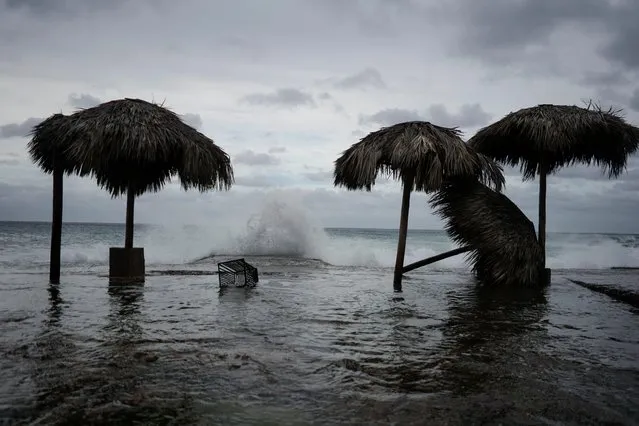 Waves splash during the passage of theTropical Storm Laura in Havana, Cuba, August 24, 2020. (Photo by Alexandre Meneghini/Reuters)