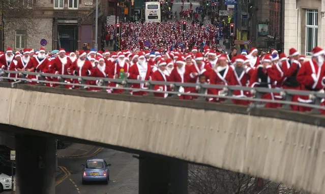 Thousands of runners dressed in Santa Claus outfits compete in the annual Santa Dash in Liverpool, northern England December 7, 2014. (Photo by Phil Noble/Reuters)