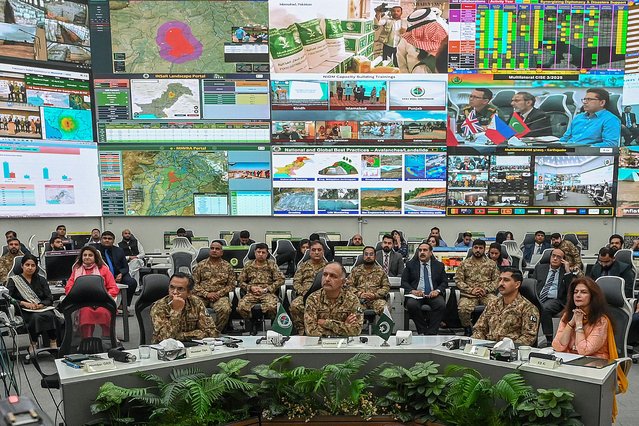 Chairman of the National Disaster Management Authority (NDMA), Lieutenant General Inam Haider (C), attends a media briefing on the ongoing monsoon-related climate disaster in Islamabad on August 17, 2025. More than 150 people are missing in northwest Pakistan, the head of the provincial disaster authority said on August 17, after flash floods that have killed at least 344 people in the country. (Photo by Aamir Qureshi/AFP Photo)