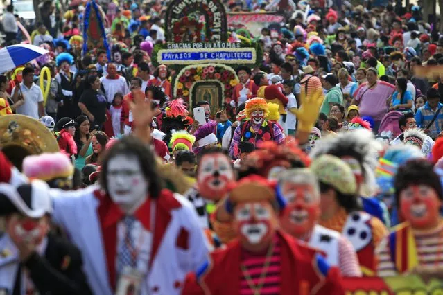 Clowns make their annual pilgrimage to the Basilica of Our Lady Guadalupe to pay homage to the Virgin of Guadalupe in Mexico City December 16, 2014. (Photo by Carlos Jasso/Reuters)